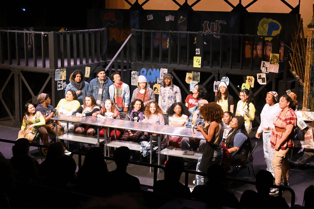 Cast of Rent performing on stage