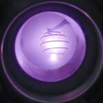 A close-up view inside a fusion reactor chamber showing a glowing purple plasma spiral. The light forms a helical pattern, radiating a soft violet hue within the circular metallic containment vessel.