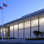 Outside exterior of the John F. kennedy center in the afternoon as lights are turning on
