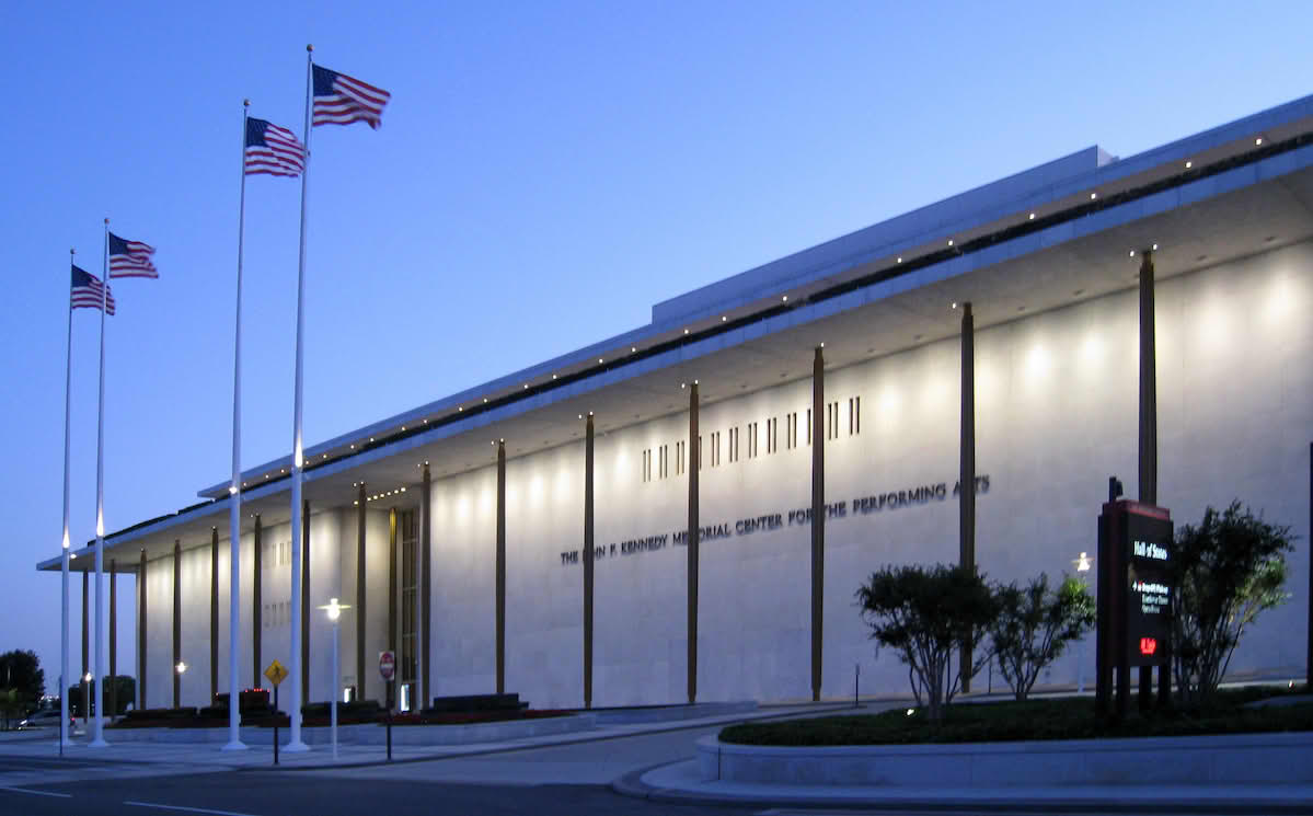 Outside exterior of the John F. kennedy center in the afternoon as lights are turning on