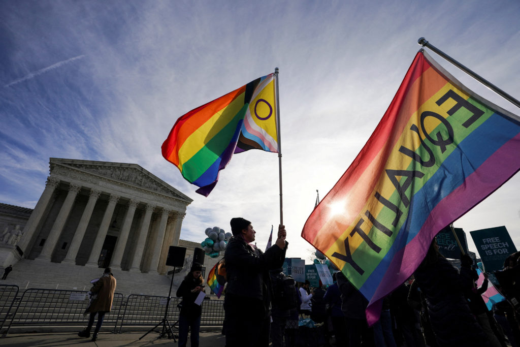 Activists gather outside U.S. Supreme Court as justices hear arguments in case involving LGBT rights in Washington