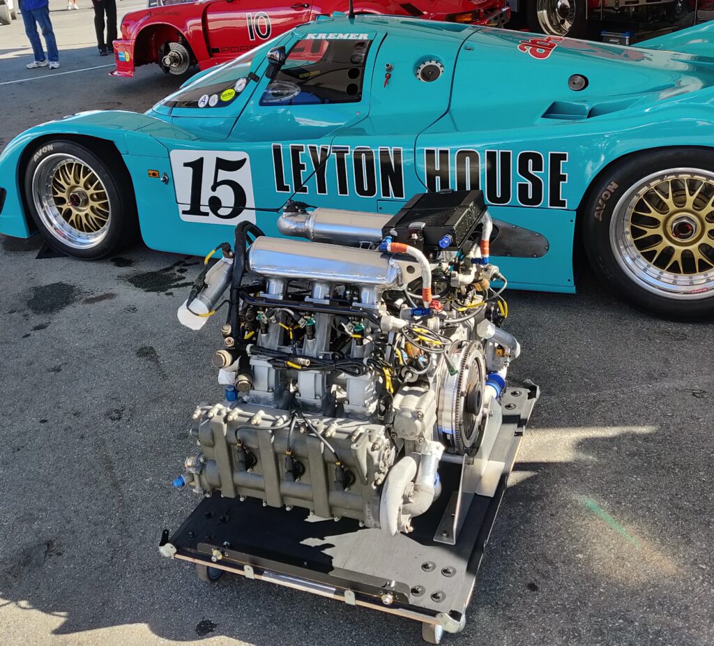 engine block laying next to race car