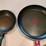 two pans sitting on table