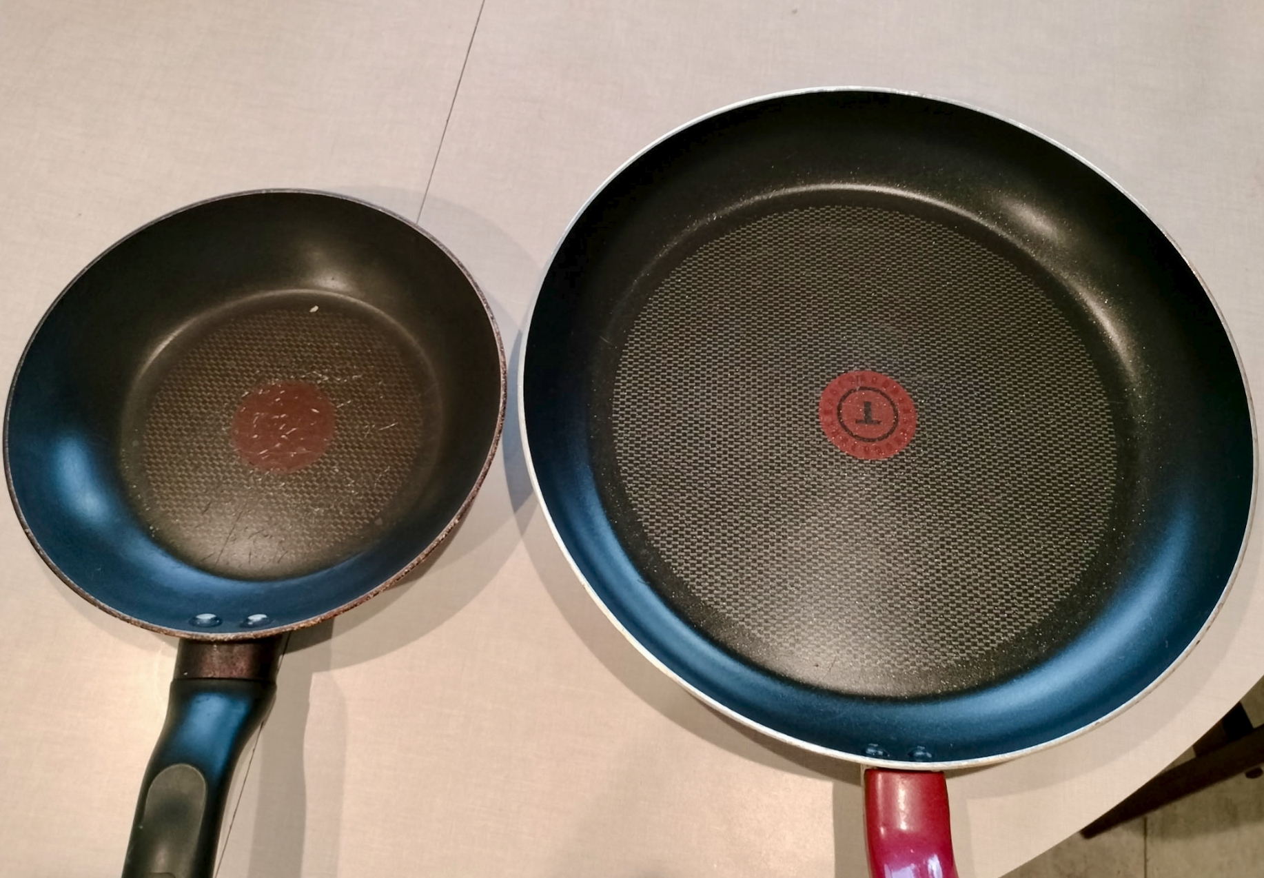 two pans sitting on table